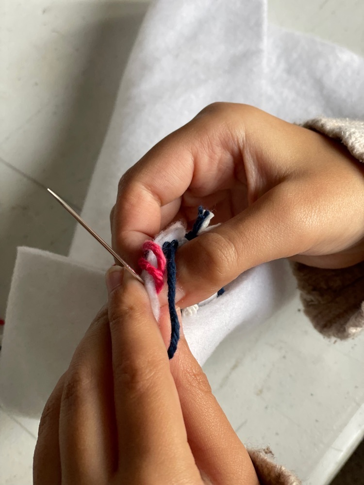 image of sewing hands 